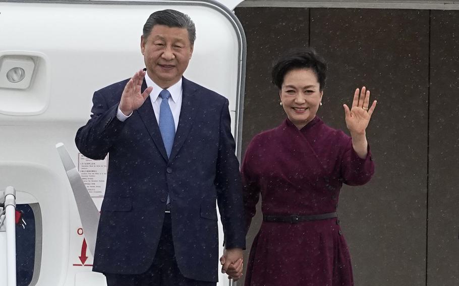 China’s President Xi Jinping and his wife Peng Liyuan wave as they arrive Sunday, May 5, 2024, at Orly airport, south of Paris. French President Emmanuel Macron will seek to press China’s Xi Jinping to use his influence on Moscow to move towards the end of the war in Ukraine, during a two-day state visit to France that will also see both leaders discuss trade issues.