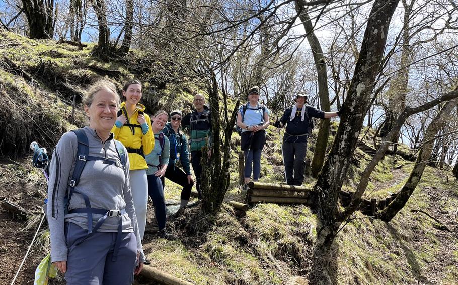 American hikers, including two Navy officers and two teachers from Yokosuka Naval Base, Japan, pose near Mount Hinokiboramaru on April 16, 2023, the day after they helped rescue a man injured on the trail. 