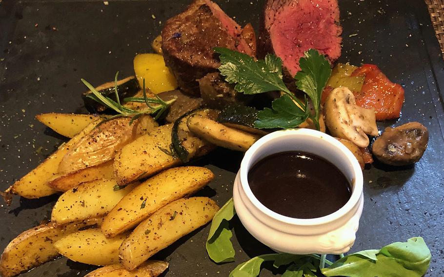 Another popular dish at the Swiss House in Bad Duerkheim, Germany, is the fillet steak accompanied with mushrooms, and potato wedges.