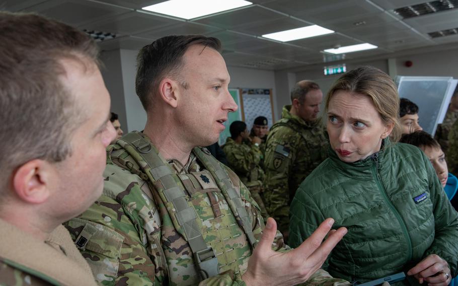 Lt. Col. David Griffith, Lt. Col. Benjamin Maher, and U.S. Ambassador to Lithuania Kara McDonald, from left, discuss U.S. Army operations in Lithuania during the ambassador’s visit to Camp Herkus, Feb. 14, 2024. Lithuania's defense minister Arvydas Anusauskas pledged this week to improve living conditions for U.S. troops deployed to the country.