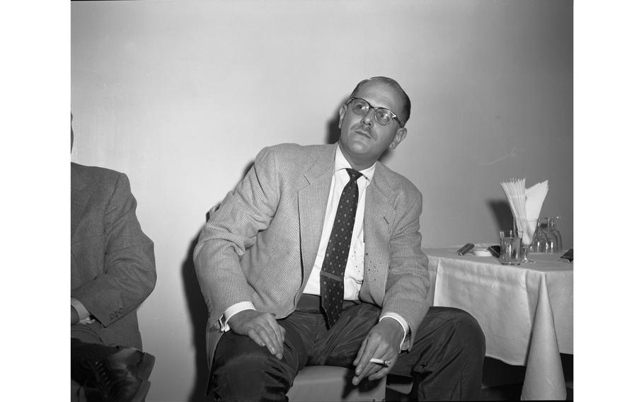 Trombonist Bill Harris enjoys a smoke at the Jazz at the Philharmonic reception at the Nikkatsu Hotel, Tokyo.