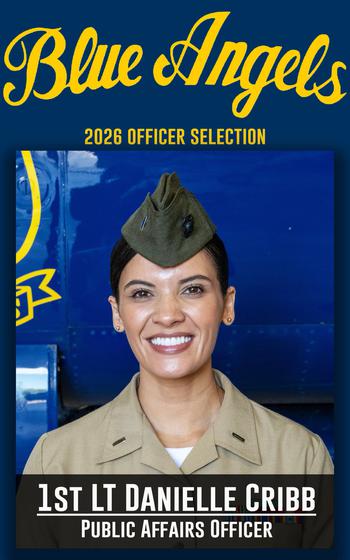 A service member smiles for a photo