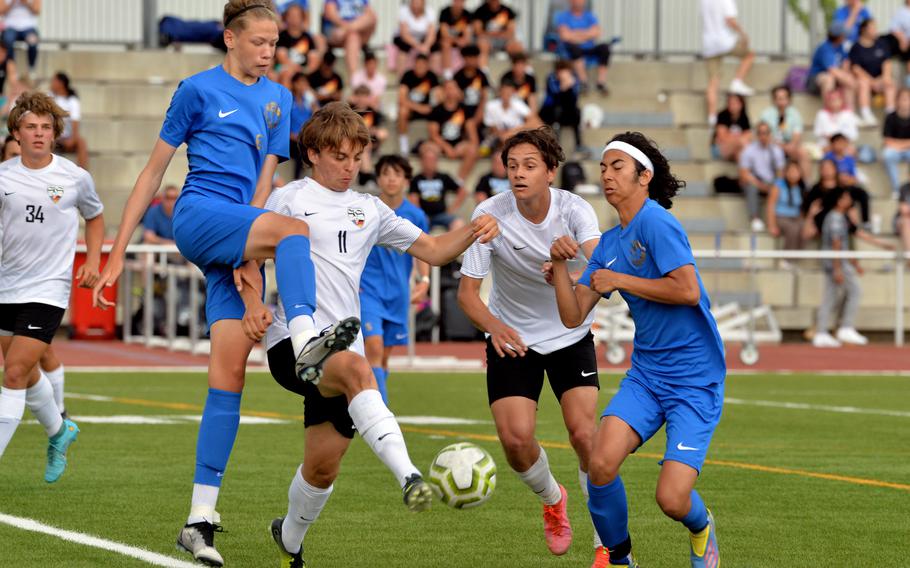 Stuttgart’s Jared Glerter clears the ball from Ramstein’s Kelan Vaughn and Tyler Rabideau as teammate Alexander Christensen follows the action in the boys Division I final at the DODEA-Europe soccer championships in Kaiserslautern, Germany, Thursday, May 19 2022. The Royals beat the Panthers 1-0 for the title.