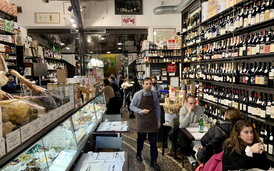 Roscioli’s interior features a delicatessen with a bistro-like dining experience. The shop sells cheese, Italian meats, wine and gourmet items.