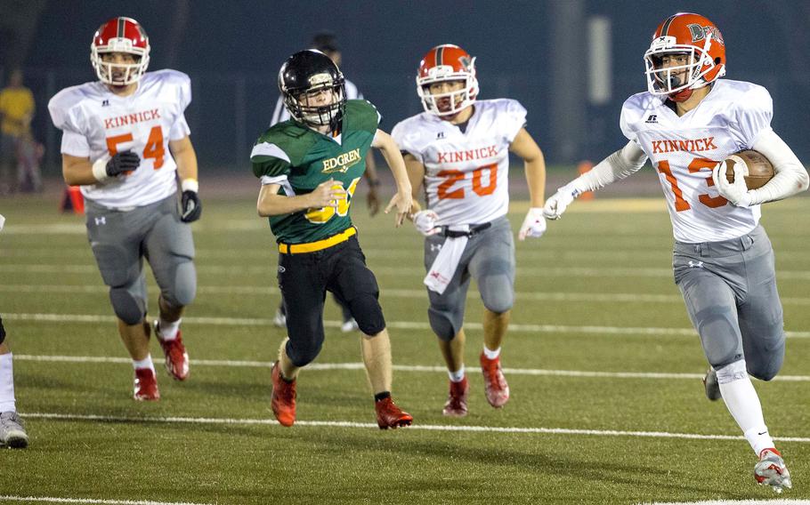 Nile C. Kinnick ballcarrier Justin Rose carries for some of his 30 rushing yards.