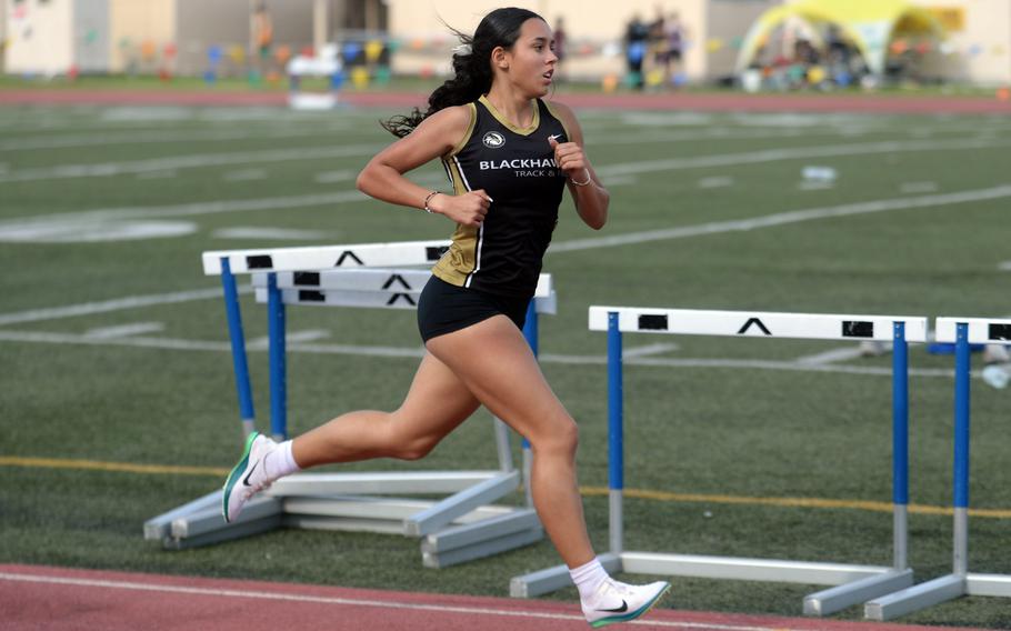 Far East Division I cross country champion Cassandra Jarzabek of Humphreys wins the 1,600 final.