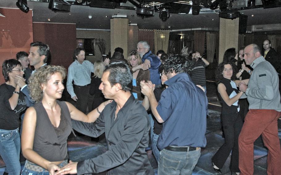 Italians and Americans dance the night away at a nightclub near Aviano Air Base, Italy, prior to the coronavirus pandemic. Italy is reopening discos and nightclubs Oct. 11, 2021, after being closed more than a year because of  pandemic restrictions.