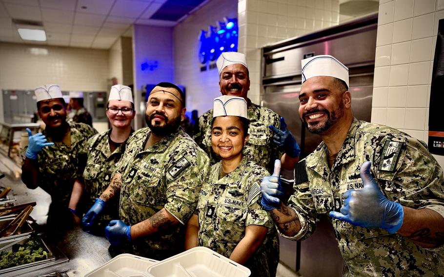 A group of Navy chiefs pose for a photo