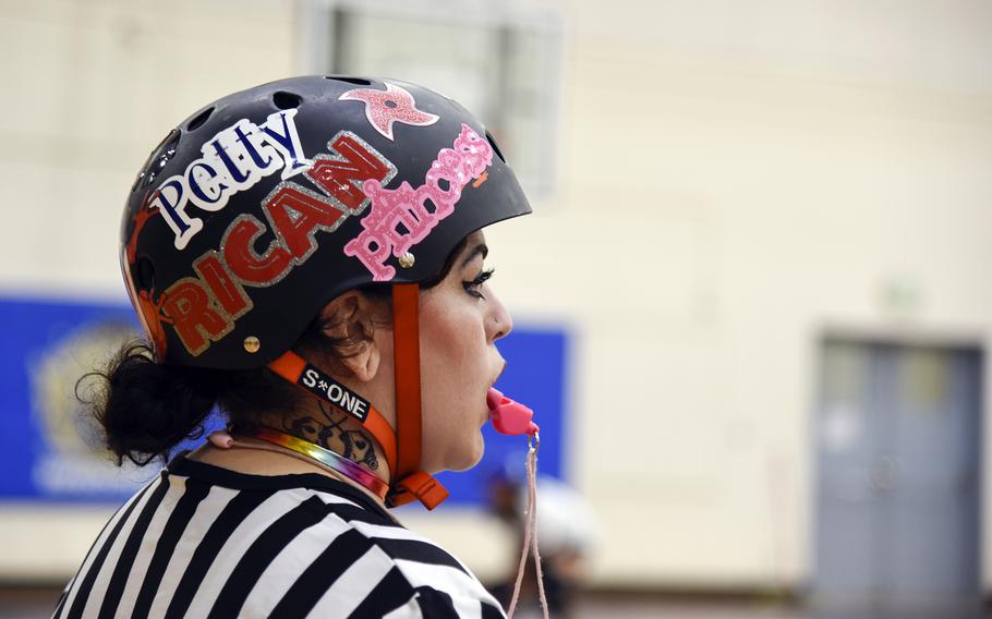 Brittney Oquendo refeeres a "Rocky Horror"-themed roller derby matchup at the Samurai Fitness Center on Yokota Air Base, Japan, Sept. 24, 2023. 