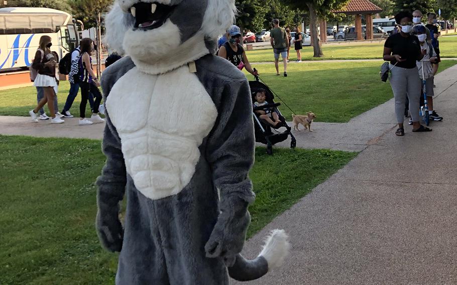 The Naples Middle High School mascot and teachers greet children and parents near the entrance Monday, Aug. 23, 2021.