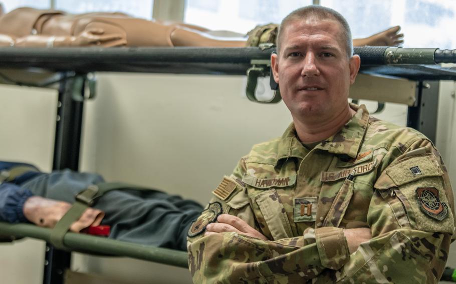 U.S Air Force Capt. Joshua Haveman, 60th Air Evacuation Squadron flight instructor, stands in front of litters and training mannequins at Travis Air Force Base, Calif., Sept. 23, 2023. Haveman was involved in the rescue of a climber on Half Dome at Yosemite National Park in California, Sept. 2, 2023. 