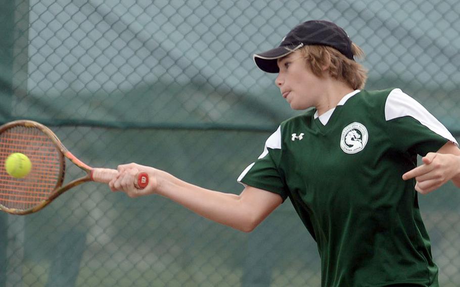 Kubasak's Owen Ruksc smacks a forehand return during Wednesday's Okinawa tennis doubles tournament. Ruksc and teammate Jaden Oshana beat Kubasaki's Canaan Jones and Cael Perry 9-8 (7-3) to take second place in the tournament; Jones and Perry finished third.