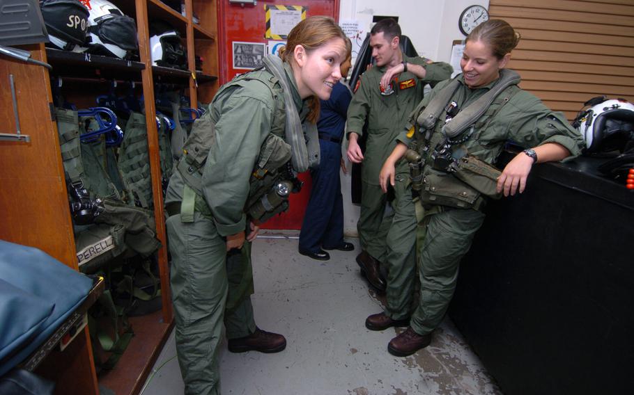 Sailors try on their flight gear 