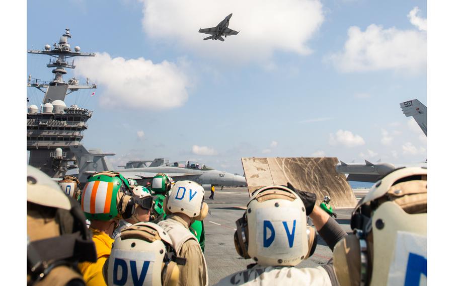 Distinguished visitors aboard Nimitz-class aircraft carrier USS George Washington (CVN 73) tour the flight deck in the Atlantic Ocean, Sept. 11, 2023. 