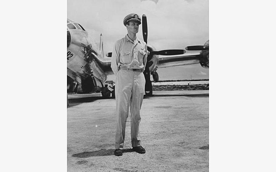 World War II veteran Navy Cmdr. Frederick Ashworth stands in front of the Enola Gay, the aircraft that bombed the Japanese city of Hiroshima.