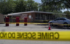 Crime scene tape surrounds Robb Elementary School in Uvalde, Texas, Wednesday, May 25, 2022. Desperation turned to heart-wrenching sorrow for families of grade schoolers killed after an 18-year-old gunman barricaded himself in their Texas classroom and began shooting, killing at least 19 fourth-graders and their two teachers.