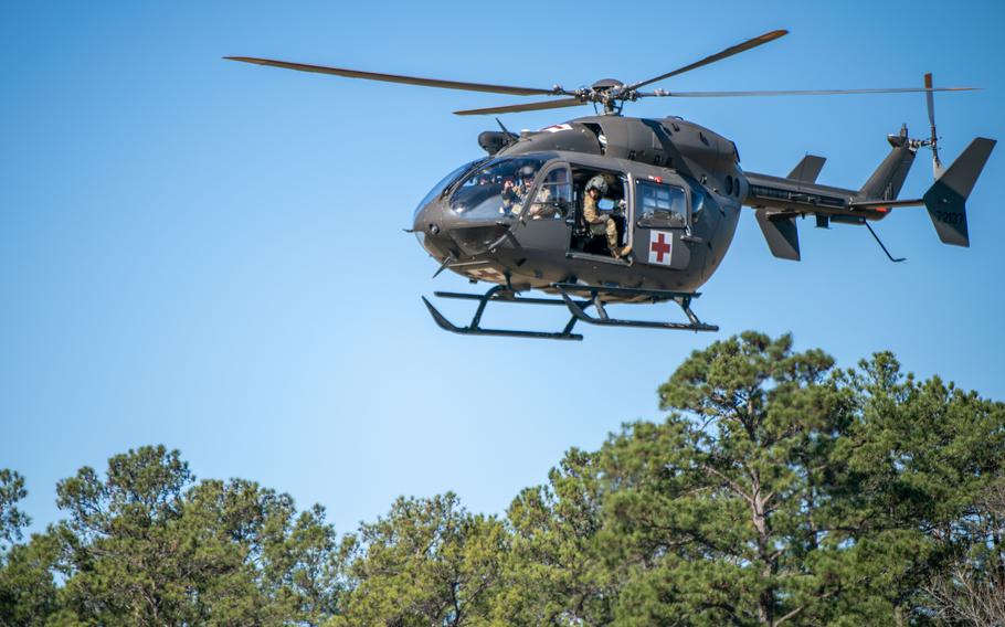 Service members on a UH-72 Lakota helicopter prepare to land for injured role-play victims during a PATRIOT 24 search and rescue exercise, Camp Shelby, Miss., Feb. 19, 2024. PATRIOT is a Domestic Operations disaster-response training exercise conducted by National Guard units working with federal, state and local emergency management agencies and first responders. 