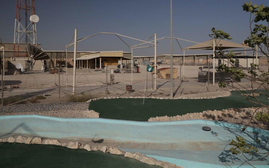 The flag on the fourth hole at the now-closed Camp As Sayliyah-Main, Qatar, miniature golf course waves in the wind on June 14, 2021. The U.S. Army shuttered CAS-Main and its two other installations in Qatar, Camp As Sayliyah-South and Falcon 78.