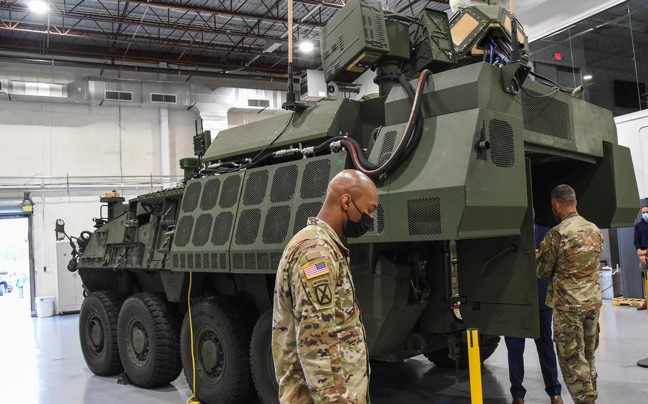 Gen. Joseph Martin, the vice chief of the Army, peers into the first prototype of the service’s new laser weapon, the Directed Energy Maneuver Short-Range Air Defense system, or DE M-SHORAD, during a visit to Huntsville, Ala. and Redstone Arsenal on April 29. 