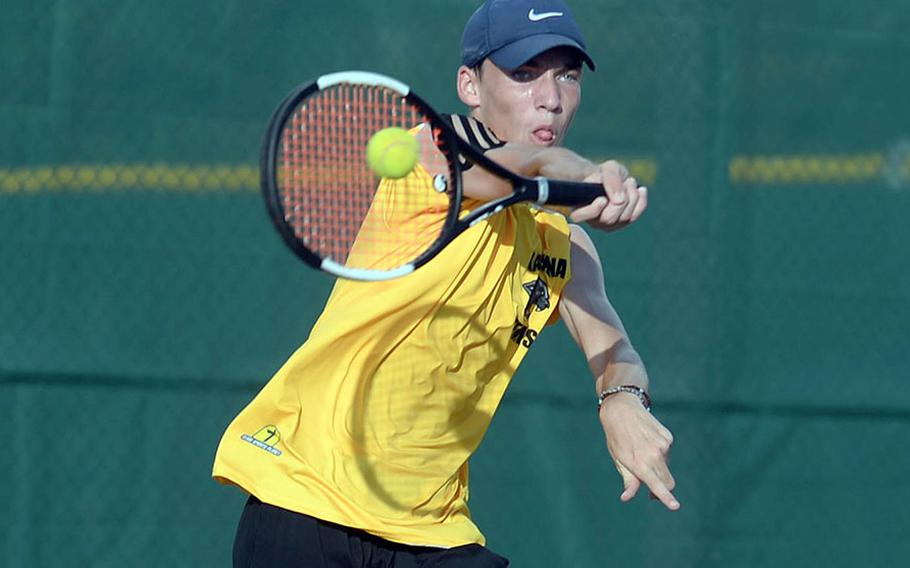 Kadena's Evan Davis smashes a forehand return against Kubasaki's Owen Ruksc during Wednesday's Okinawa tennis matches. Davis won 9-8 (7-4).