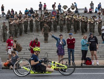 The Marine Base Quantico Band plays as an athlete rolls past near the 10-mile mark of the 48th Marine Corps Marathon on Sunday, Oct. 29, 2023, in Arlington, Va.