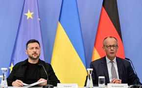 Ukrainian President Volodymyr Zelenskyy, left, and German Chancellor Friedrich Merz attend a video meeting of European leaders with US President Donald Trump on the Ukraine war in Berlin, Germany, Wednesday, Aug. 13, 2025, ahead of the summit between the US and Russian leaders. (John MacDougall/Pool Photo via AP)