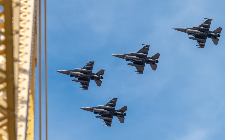 Four F-16 Fighting Falcons from the Ohio Air National Guard’s 180th Fighter Wing in Toledo, Ohio, streak over the Clark Memorial Bridge to kick off the Thunder Over Louisville air show in Louisville, Ky., Saturday, April 20, 2024.