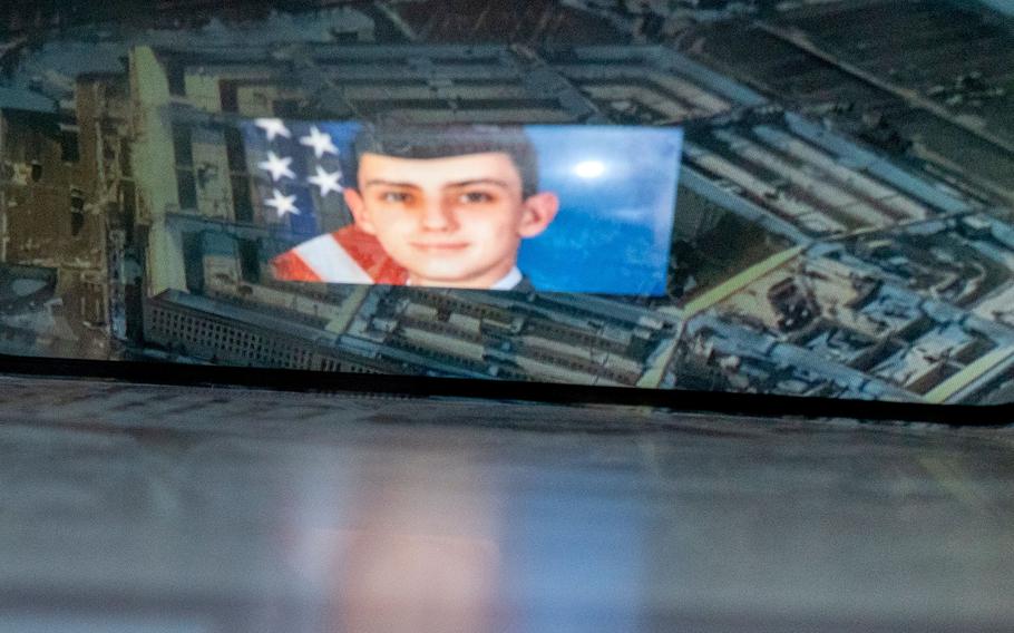 A photo illustration created on April 13, 2023, shows the suspect, National Guardsman Jack Teixeira, reflected in an image of the Pentagon in Washington, D.C. 