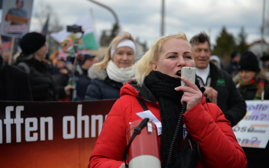 Elena Kolbasnikova leads a pro-Russia peace protest march in downtown Ramstein-Miesebach, Germany, on Feb. 26, 2023. Nearly 2,500 people gathered to march from Ramstein’s main train station to a rally near Ramstein Air Base to protest against weapons deliveries to Ukraine.