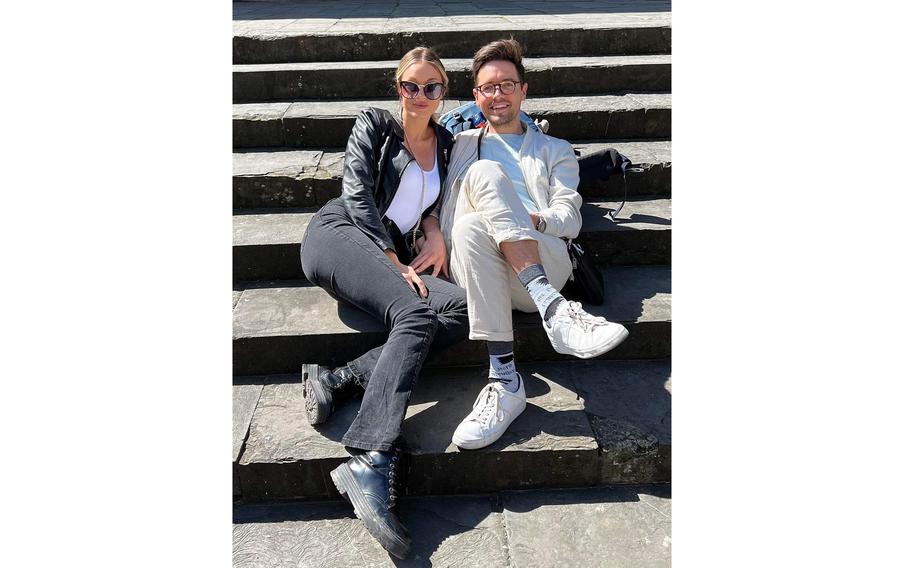 Tine Kirby and Kiefer Jones relax on the stairs in Florence, Italy, on April 18, 2022. The couple, who live near Aviano Air Base, have begun taking their first outings since Jones suffered serious injuries in a snowboarding accident in Austria in January. 
