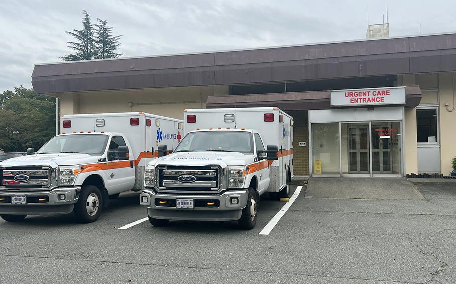Ambulances park outside the 374th Medical Group's urgent care center at Yokota Air Base, Japan, Wednesday, Oct. 12, 2022. 