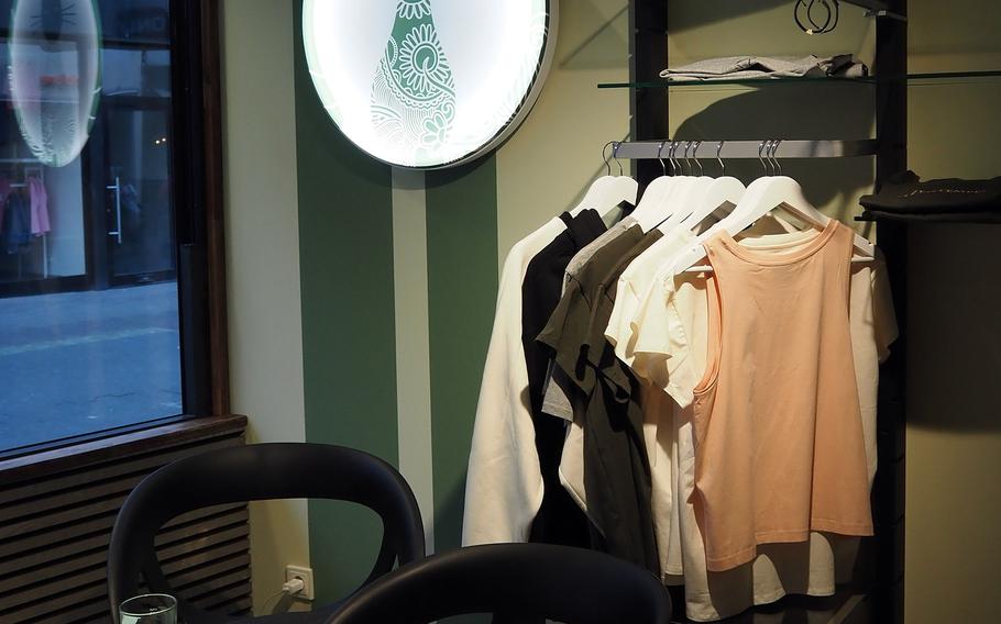 T-shirts, tote bags and other merchandise is for sale at Katzentempel cat cafe in Trier, Germany.