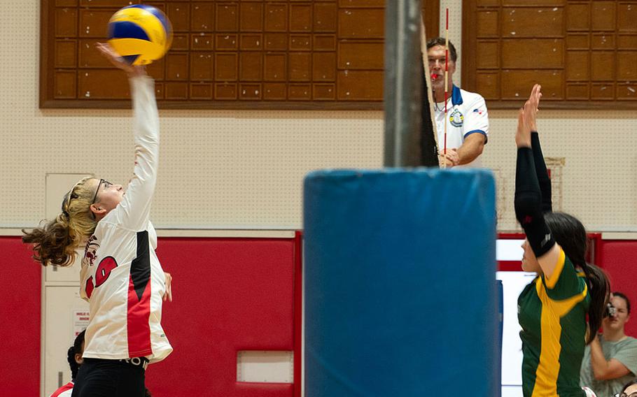 Nile C. Kinnick's Isabella Harts spikes against Robert D. Edgren's Milan Bean during Friday's DODEA-Japan volleyball match. The Red Devils won in straight sets.