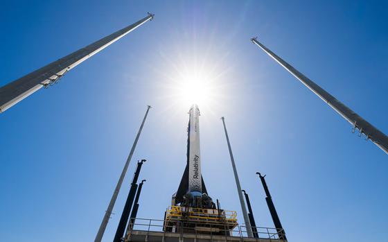In this photo provided by Relativity Space, the company's Terran 1 rocket sits on a launch pad in Cape Canaveral, Fla., on Wednesday, March 22, 2023. About 85% of the structural mass of the rocket is manufactured with 3D printing technology, including its engines. (Relativity Space via AP)