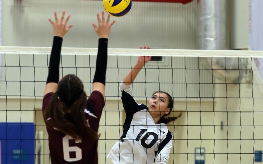 Zama's Emma Sakamoto-Flack spikes against Matthew C. Perry's Nevaeh Martinez.