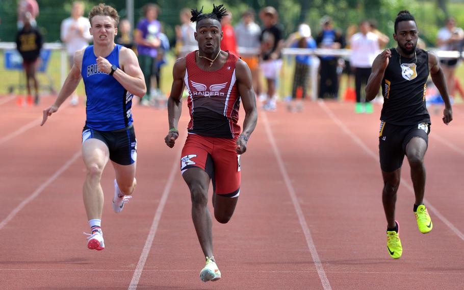 Kaiserslautern’s Larry Haynes won the boys 100-meter dash in 11.14 seconds. Brussels’ William Pierce, left, finished third, while Stuttgart’s Josiah Doughty was fourth. Haynes also took gold in the 200-meter race.