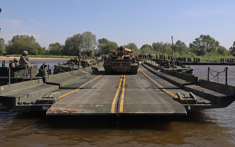 An M1A2 Abrams Tank crosses the ribbon bridge during a wet gap crossing as a part of Defender-Europe 2022 at Dęblin, Poland, May 12, 2022.