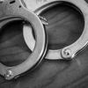 A set of handcuffs sit on a bedside table inside a Muncie, Ind., hotel on Tuesday, Jan. 30, 2018.