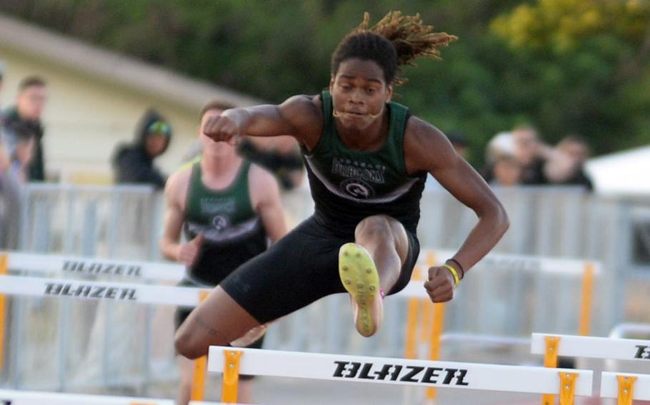 Carlos Cadet clears a hurdle.