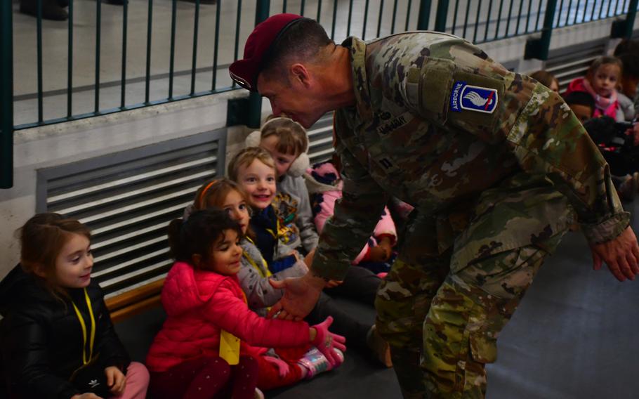 U.S. Army Capt. Vernon Snyder, the 54th Brigade Engineer Battalion chaplain, greets children in Camisano Vicentino, Italy, on Dec. 5, 2023, during the unit's annual toy drive.