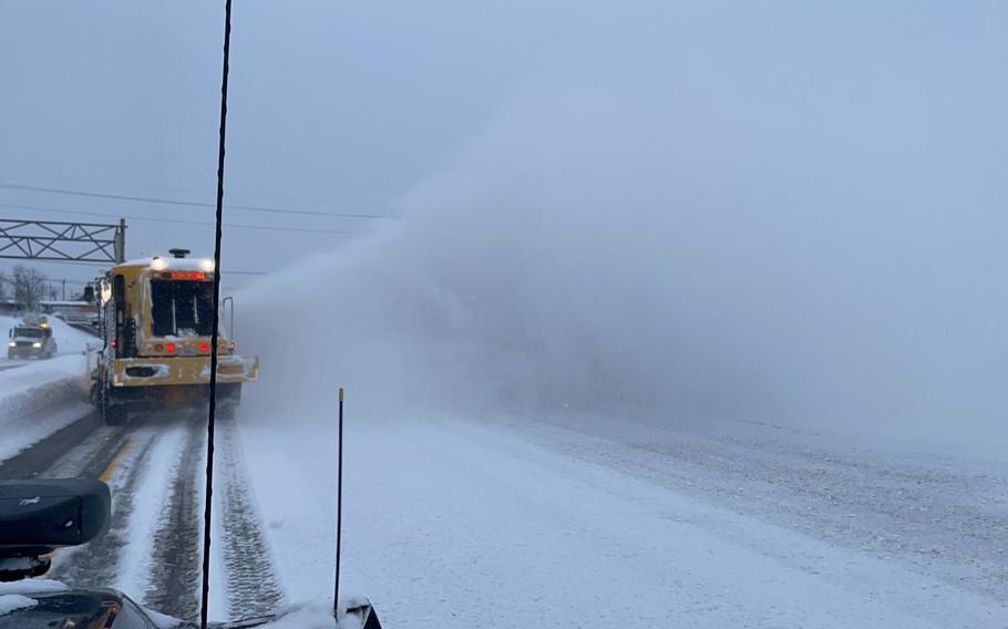 New York Air National Guard airmen assigned to the 174th Attack Wing us a runway clearing snowblower to remove snow from I-90 in Buffalo, N.Y., on Dec. 26, 2022.