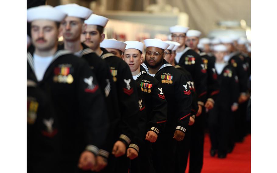 The crew of the pre-commissioning unit (PCU) Idaho (SSN 799) march in formation during a christening ceremony at General Dynamics Electric Boat shipyard facility in Groton, Conn., Saturday, March 16, 2024.