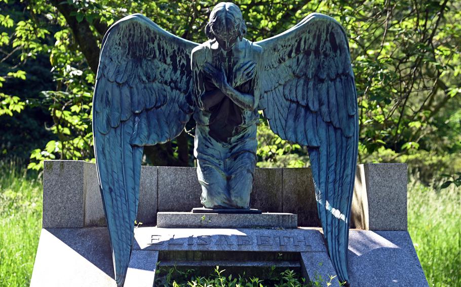 An angel by the Art Nouveau artist Ludwig Habich looks onto the grave of Princess Elisabeth, the daughter of Grand Duke Ernst Ludwig, who died in 1903, in the Rosenhoehe Park in Darmstadt, Germany. The park includes two mausoleums for the ducal family, and the graves of the grand duke and the five members of his family that were killed in a plane crash a month after his 1937 death.