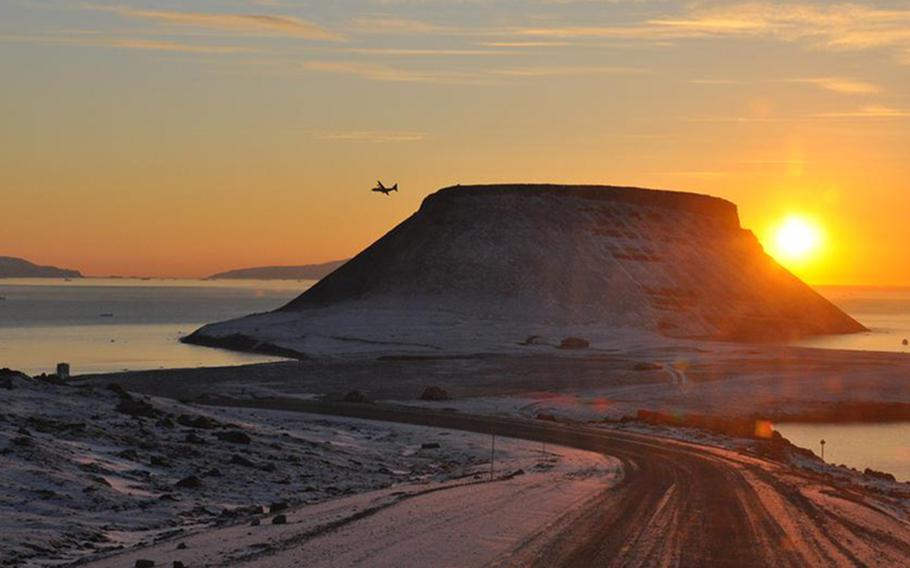 Approaching Thule Air Base, a plane banks over Greenland's Baffin Bay. A $3.95 billion contract has been awarded to ensure the ongoing operation of Thule.