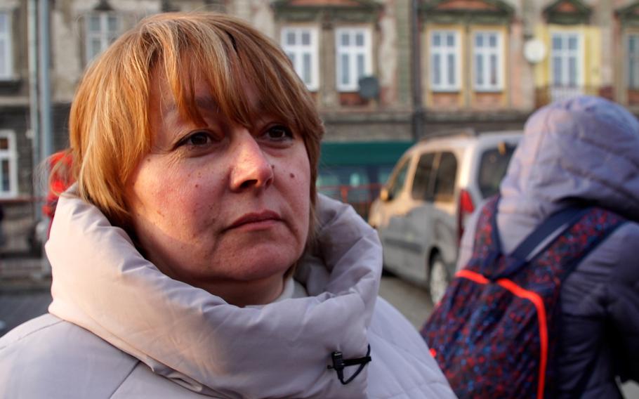 Vira Lapchuk waits to board a train to Kyiv at the Przemysl train station. She's returning to Ukraine because she feels her family and community need her back home.