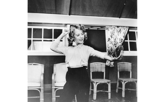 Hed: Charmed, 1957

Kadena Air Base, Okinawa, October 1957: A glance of approval is cast at her blonde tresses by Cheryl Greenwood, one of the teenagers learning hair dressing at the Teen Haven Charm School conducted for youngsters at Kadena AB, Okinawa. 

Looking for Stars and Stripes’ coverage of overseas military life through the decades? Subscribe to Stars and Stripes’ historic newspaper archive! We have digitized our 1948-1999 European and Pacific editions, as well as several of our WWII editions and made them available online through https://starsandstripes.newspaperarchive.com/

META TAGS: military child; military family; Month of Military Child
