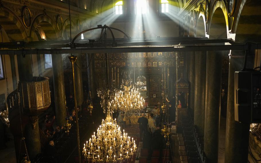 Ecumenical Patriarch Bartholomew I, at right, the spiritual leader of the world’s Orthodox Christians, leads the Epiphany Mass at the Patriarchal Church of St. George in Istanbul, Turkey, Thursday, Jan. 6, 2022.