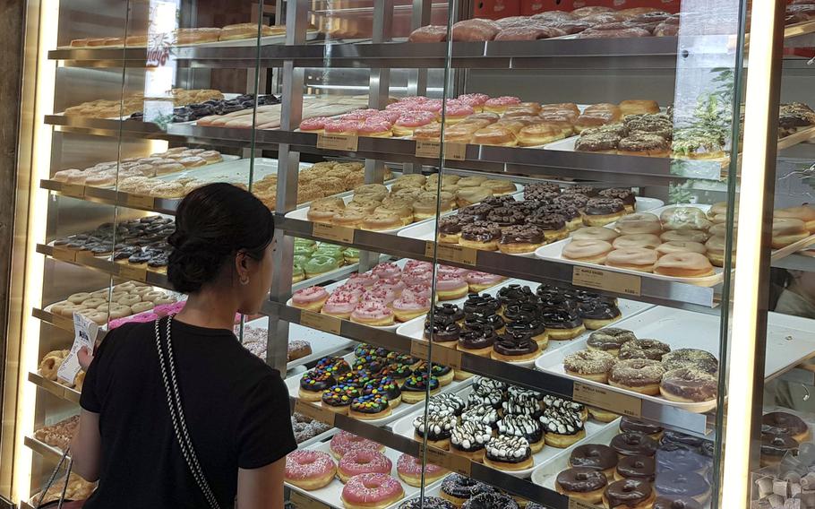 A customer browses the selection at Randy’s Donuts in Tokyo, June 28, 2025.
