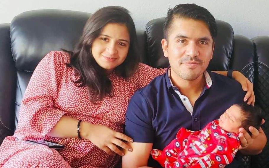 Laily and Hekmat Ghawsi hold their son, Jasoor, at their home in Las Vegas, in a photo taken in August 2022. Laily Ghawsi evacuated Afghanistan in 2021 with the help of her husband Hekmat, and would give birth to her son on July 7, 2022.