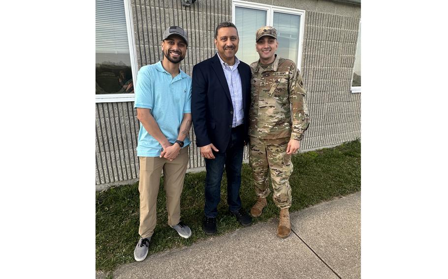 Connecticut Army National Guard Sgt. Luis Gonzalez Jr., right, poses for a photo with his father, Luis Gonzalez Sr., center, and brother, Giovanni Gonzalez, left, after being promoted to the rank of sergeant. 